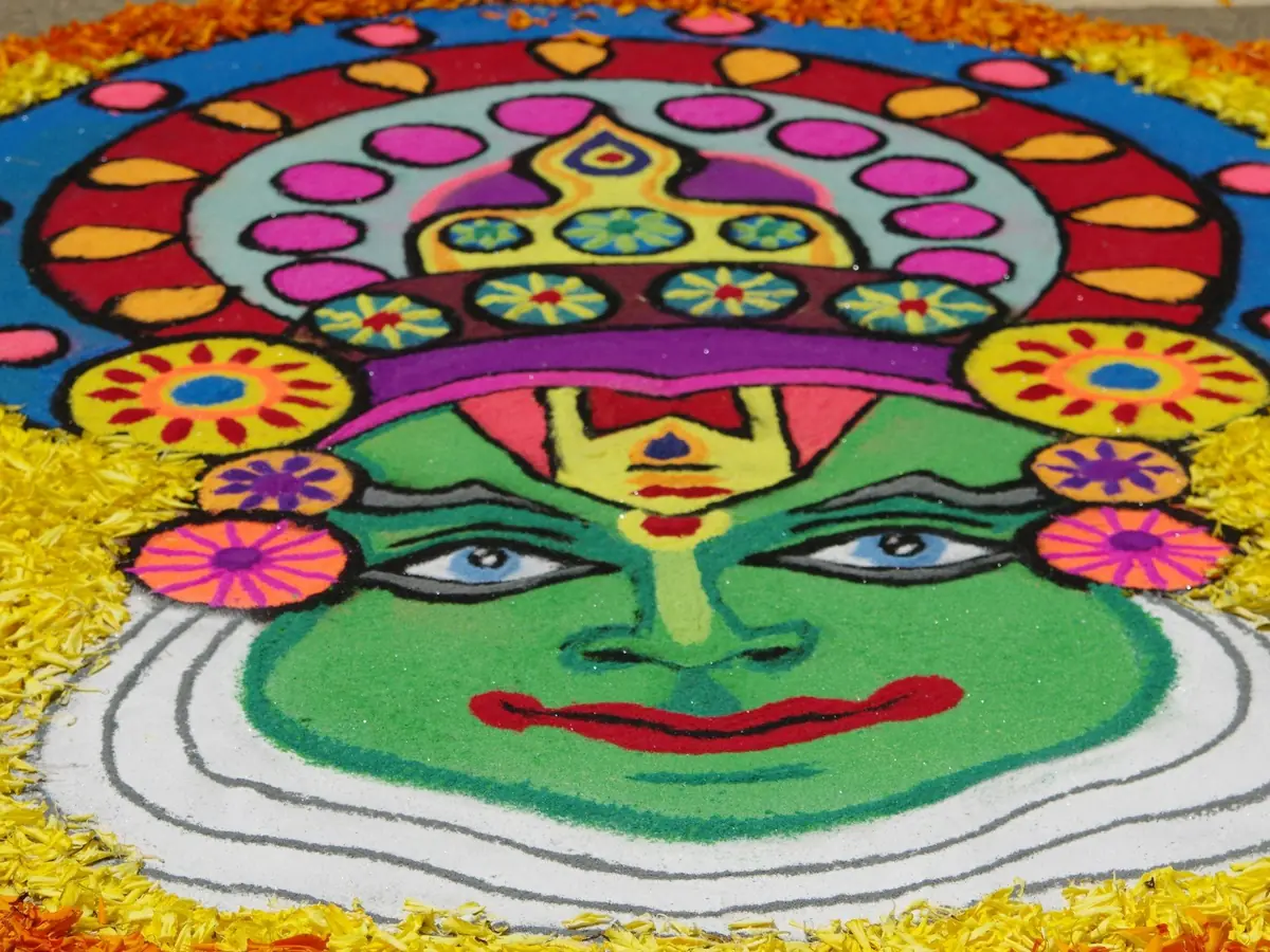A pookalam flower carpet with a Kathakali face
